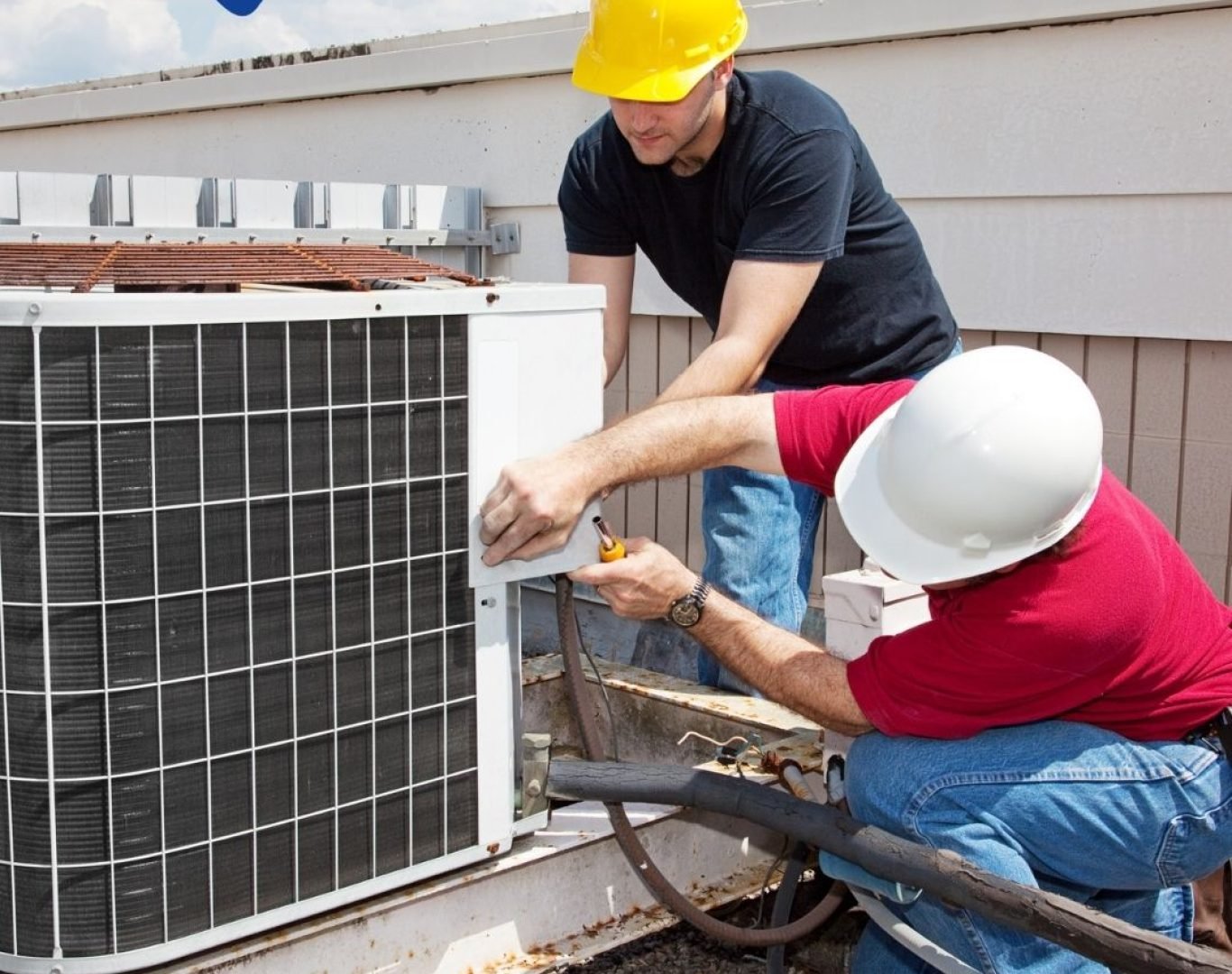 HVAC technician servicing an air conditioning unit in Wake County, NC